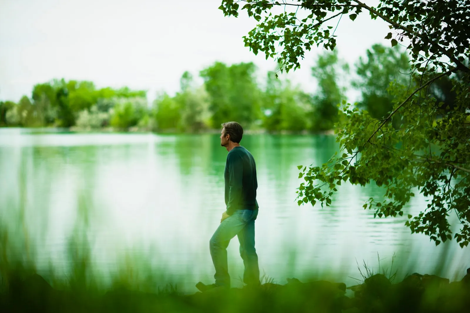 a-man-standing-alone-looking-into-the-distance-across-the-water-deep-in-thought-.jpg a-man-standing-alone-looking-into-the-distance-across-the-water-deep-in-thought-.jpg